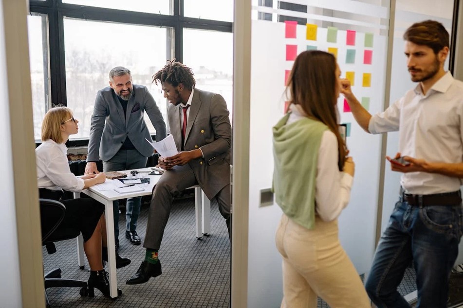 scene in an office, workers talking